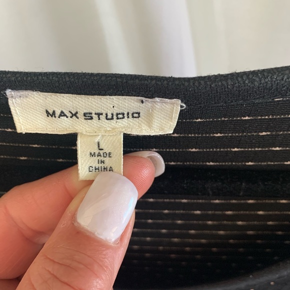 Really cute dress. Fits nice, slight flare at hem is flattering. Stretchy - Picture 3 of 5